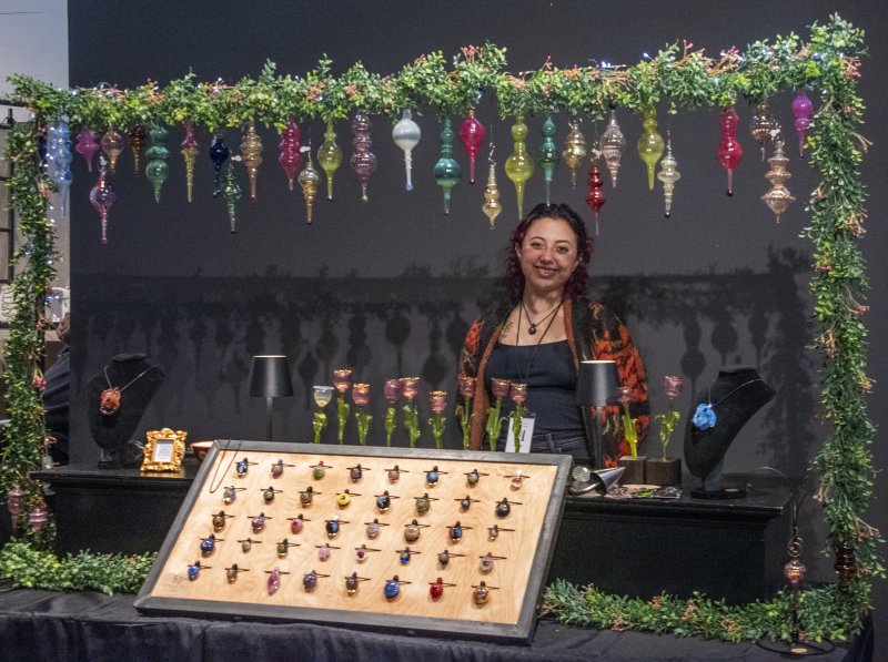 Showing her art is Izzy Cohen of I.C. Glass, who works in the lampwork style. DENY HOWETH PHOTOS